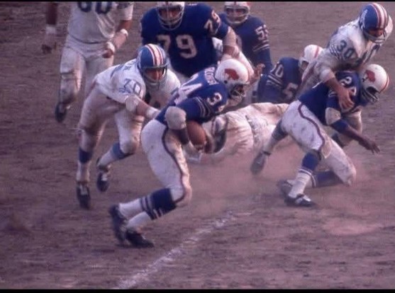 Buffalo Bills fullback Cookie Gilchrist fights for yardage against the Houston Oilers, 1964
